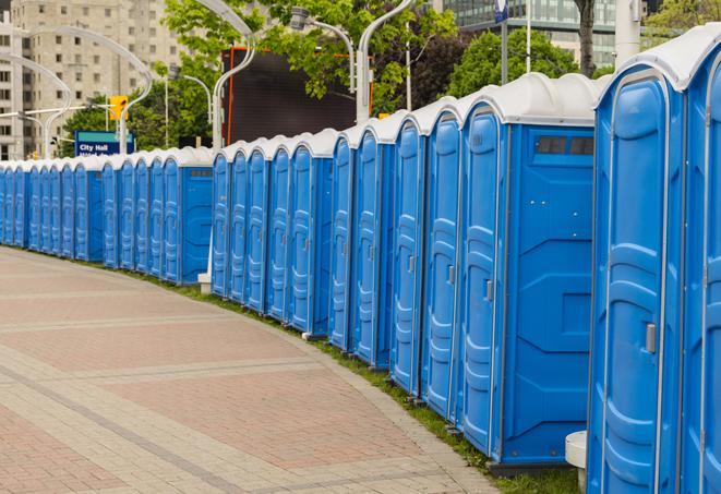 a row of portable restrooms at a fairground, offering visitors a clean and hassle-free experience in norwood